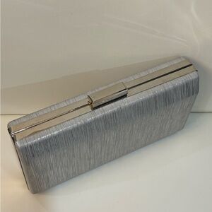 Elegant Silver Clutch with chain strap.